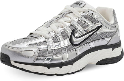 A Nike running shoe in metallic silver and white.