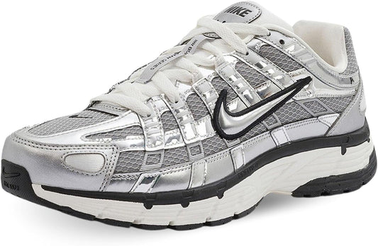 A Nike running shoe in metallic silver and white.