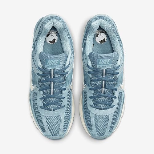 A pair of Nike running shoes in a light blue