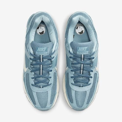 A pair of Nike running shoes in a light blue