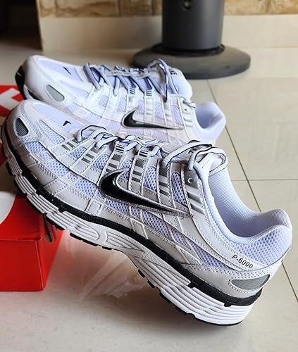 A pair of Nike running shoes in white, 