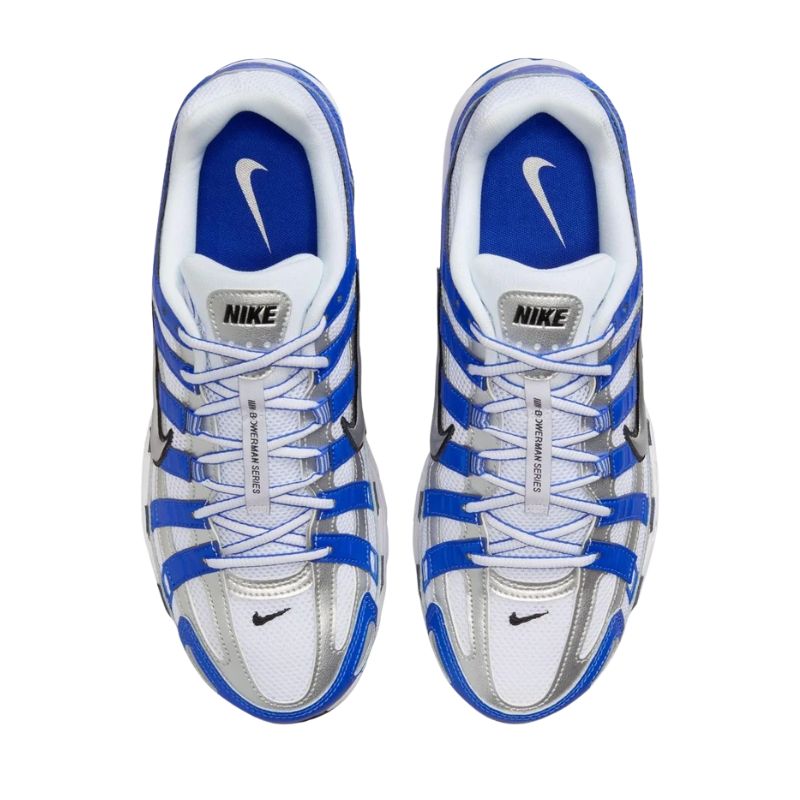 A pair of Nike running shoes in white, blue, and silver, shown from a top-down view on a plain white background.